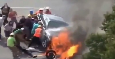 people helping man in accident.jpg