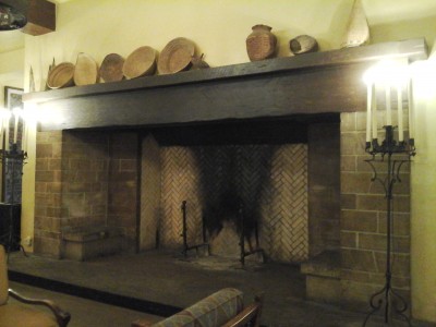 The massive fireplace within one of  the hotel lounges