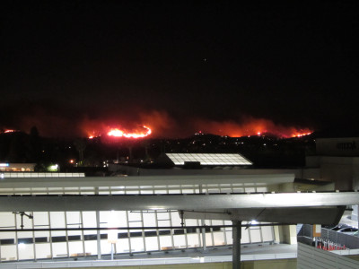 From the parking structure at the mall, Fire skimming along the Santa Susana mountains.