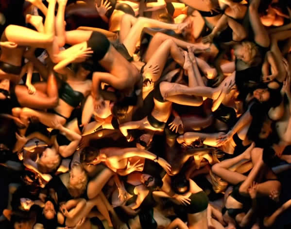 dozens of nearly nude bodies making out