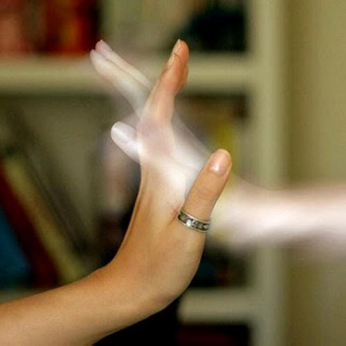 human hand intertwining fingers with ghost hand